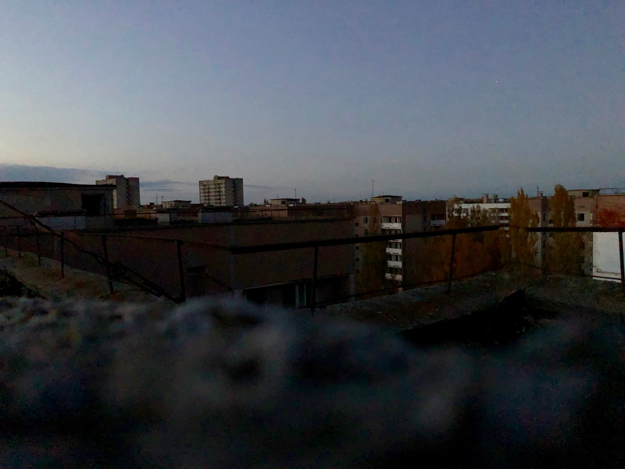 On top of 10 story building at sunset